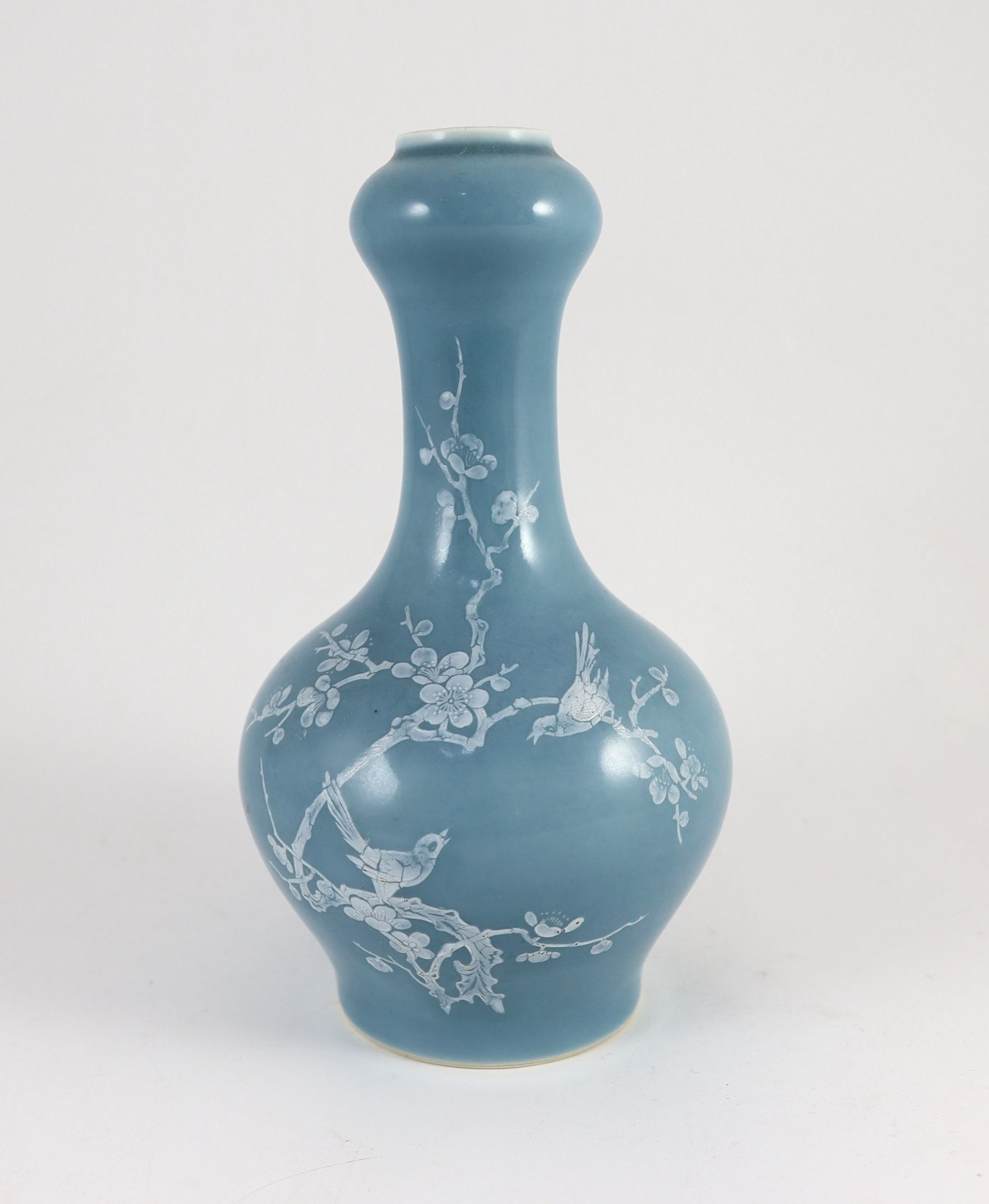 A Chinese claire de lune glazed white slip decorated vase - 25cm high